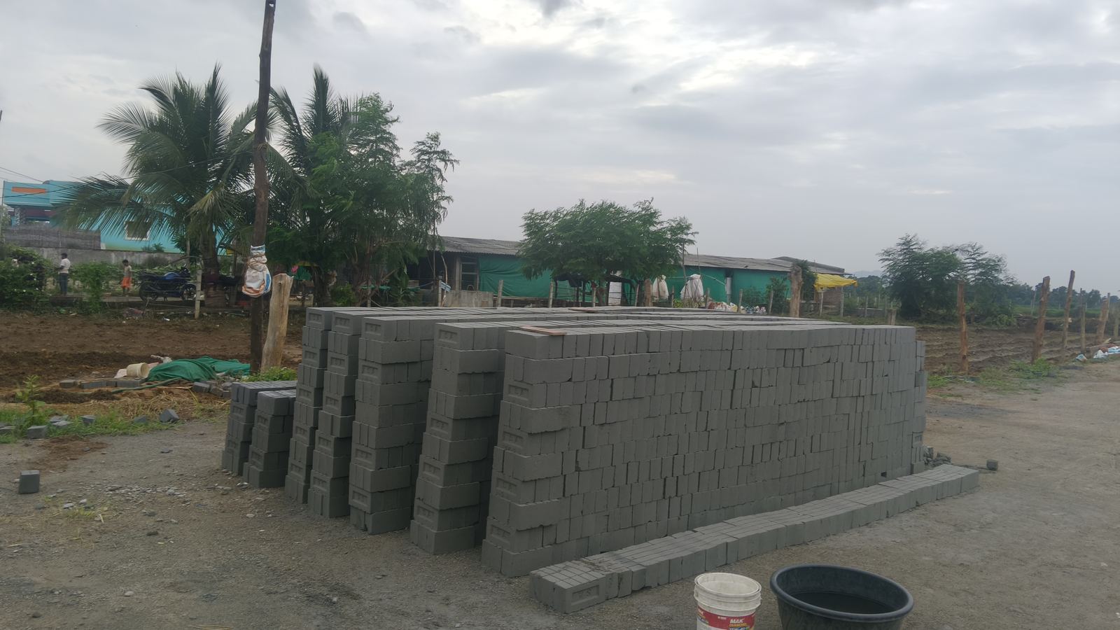 Long rows of stacked bricks at the yard